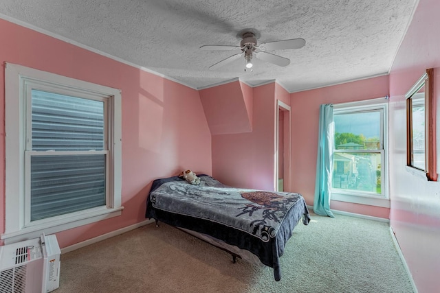 bedroom featuring a textured ceiling, ceiling fan, and carpet flooring