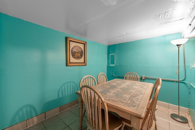 dining area featuring tile patterned floors