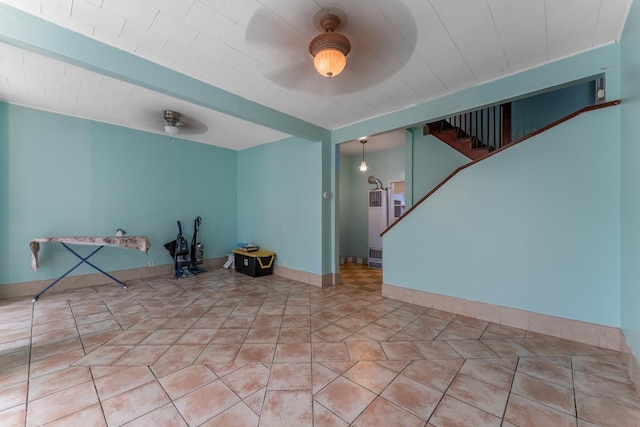 interior space featuring tile patterned floors and ceiling fan