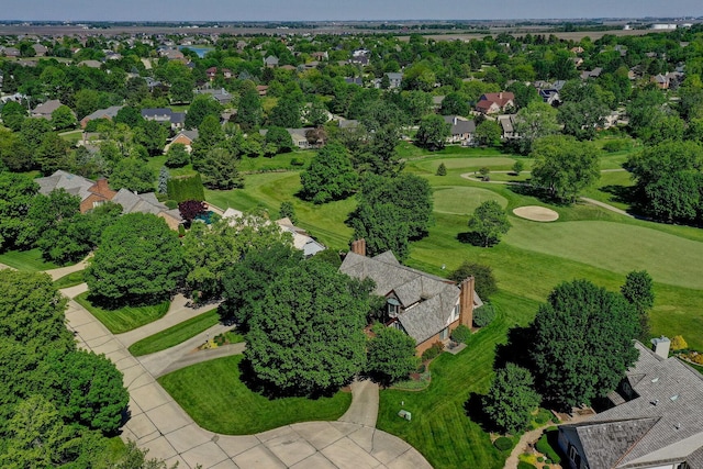 aerial view with golf course view and a residential view