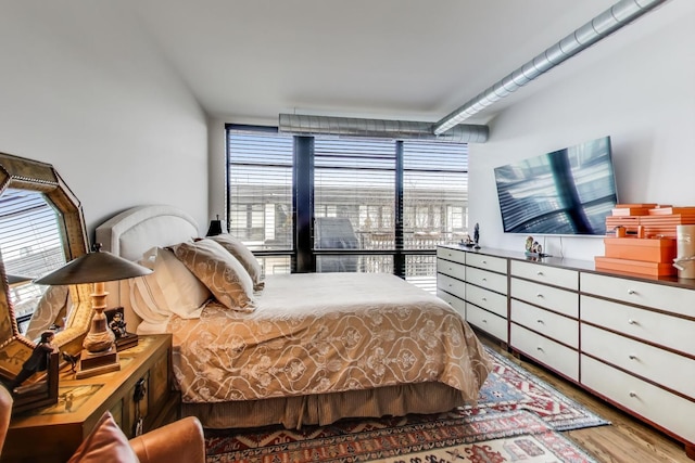 bedroom featuring wood finished floors