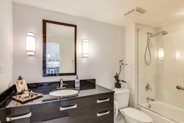 bathroom with visible vents, vanity, toilet, and shower / bathtub combination