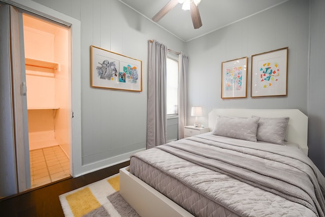 bedroom featuring dark wood-type flooring and ceiling fan