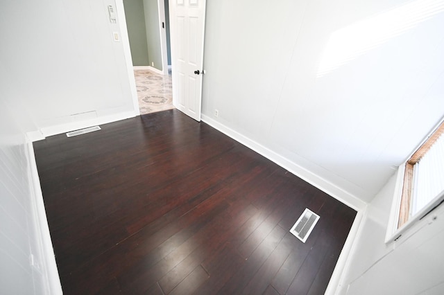 spare room with hardwood / wood-style floors