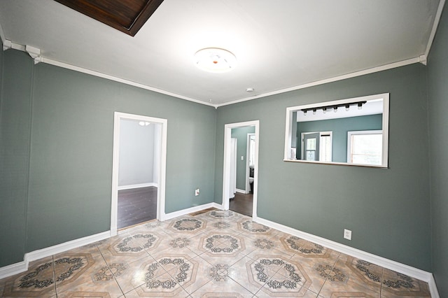 unfurnished bedroom featuring ornamental molding and tile patterned floors