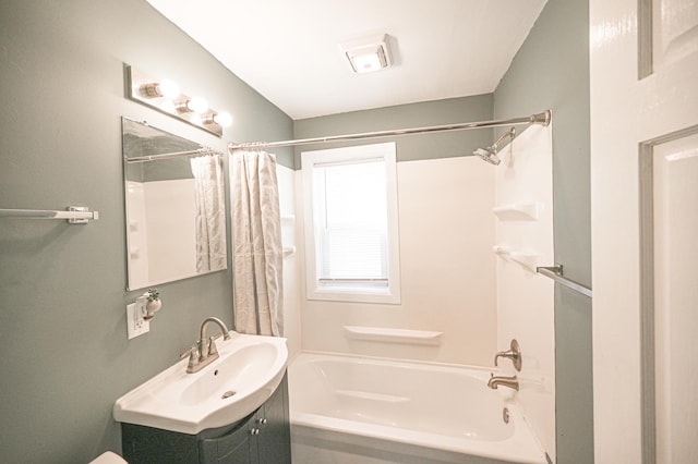 full bathroom with shower / bath combination with curtain, vanity, and toilet