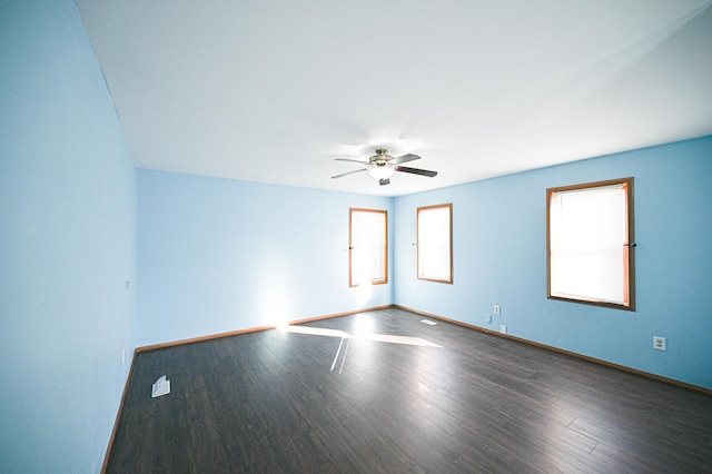 unfurnished room with hardwood / wood-style flooring, a wealth of natural light, and ceiling fan