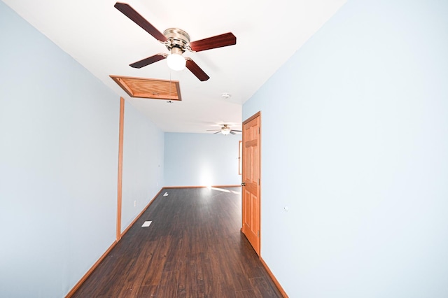 hallway with dark hardwood / wood-style floors