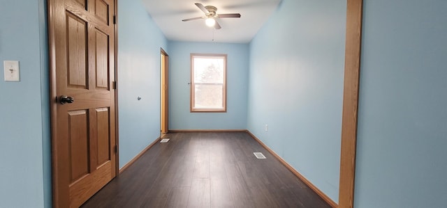 hallway with dark hardwood / wood-style flooring