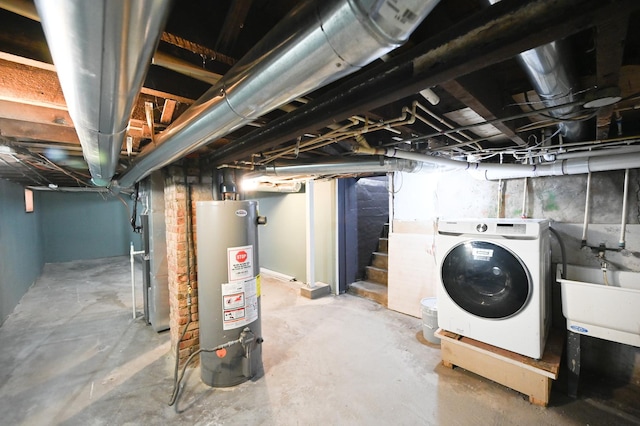 basement with heating unit, washer / clothes dryer, sink, and water heater