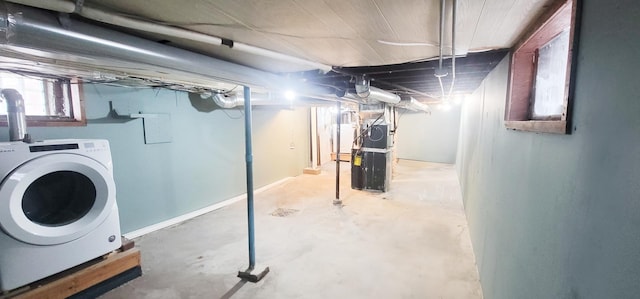 basement featuring washer / clothes dryer and heating unit