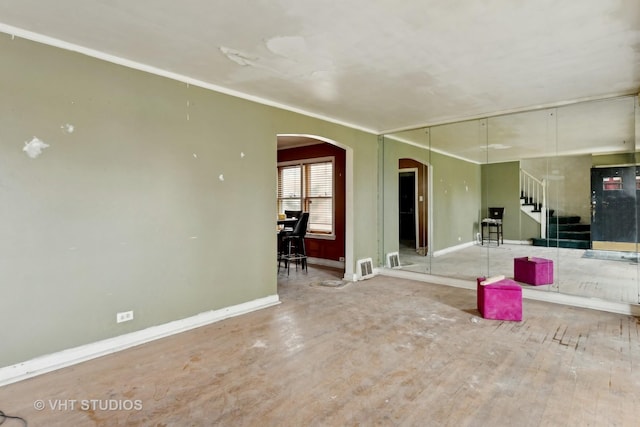 unfurnished room featuring crown molding