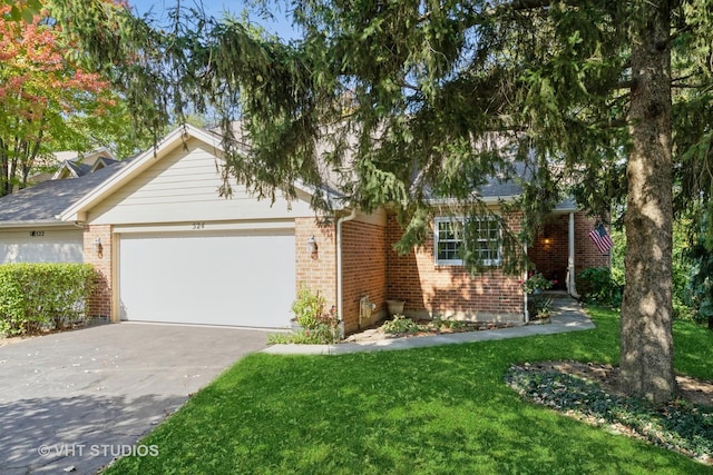 view of front of property featuring a garage and a front lawn