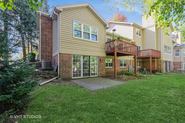 back of house featuring a wooden deck, a yard, a patio area, and central air condition unit