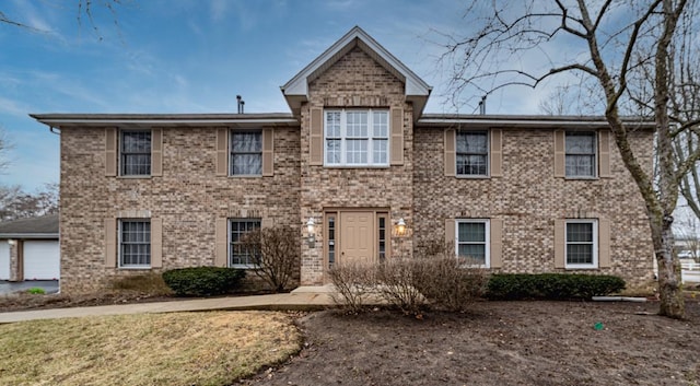 view of front of home featuring brick siding