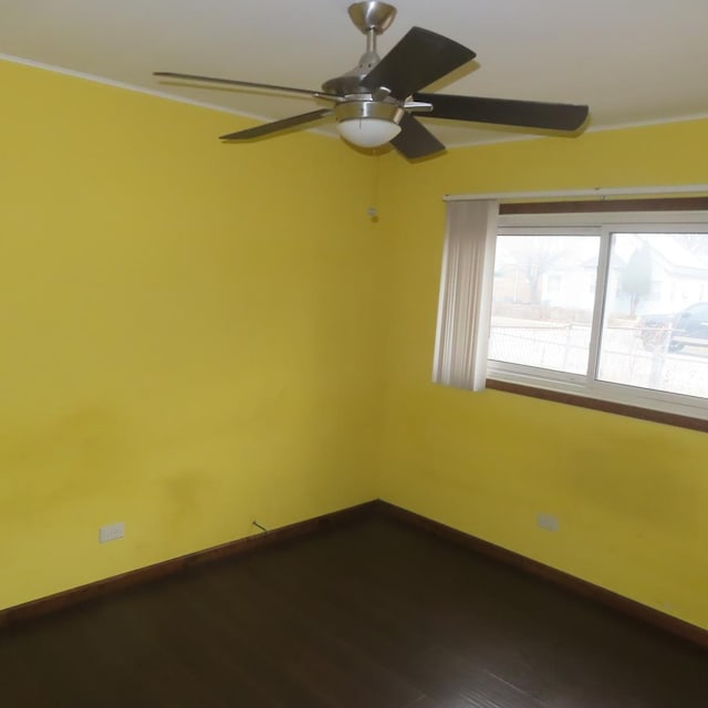 unfurnished room with hardwood / wood-style flooring and ceiling fan