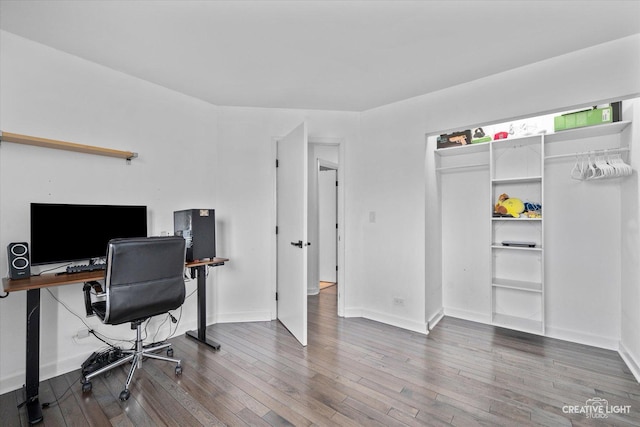 office space featuring baseboards and hardwood / wood-style floors