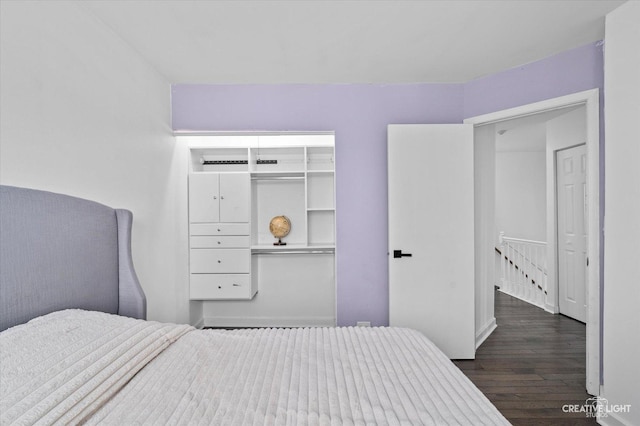 bedroom featuring a closet and dark wood finished floors