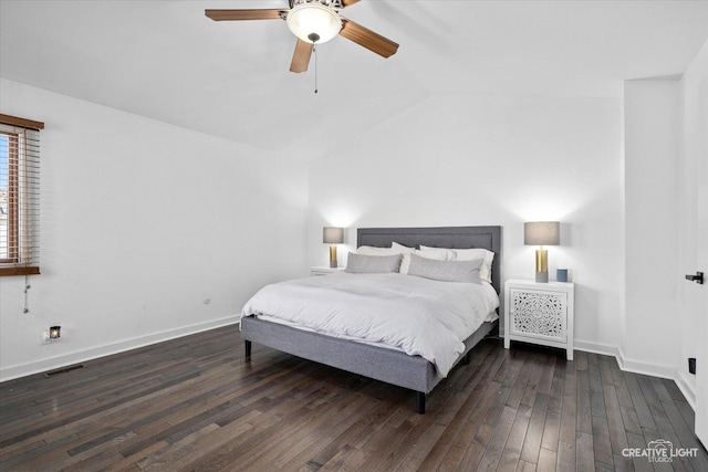 bedroom with a ceiling fan, baseboards, visible vents, vaulted ceiling, and hardwood / wood-style flooring