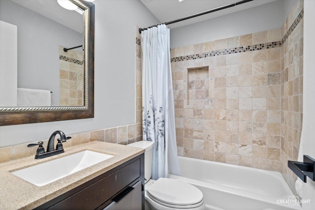 bathroom with shower / bathtub combination with curtain, toilet, and vanity