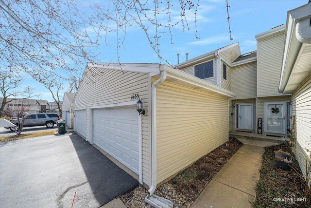 view of side of property featuring a garage