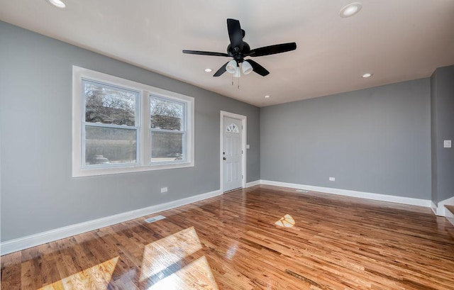 interior space with ceiling fan and light hardwood / wood-style floors