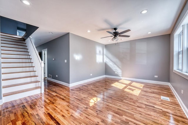 unfurnished living room featuring light hardwood / wood-style flooring and ceiling fan