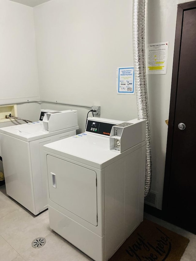 washroom with washing machine and clothes dryer