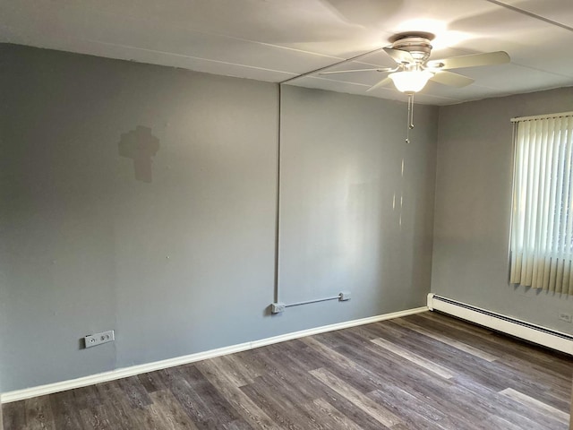 unfurnished room featuring baseboard heating, ceiling fan, and wood-type flooring