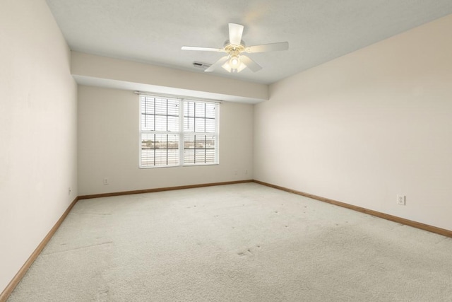 carpeted empty room with ceiling fan