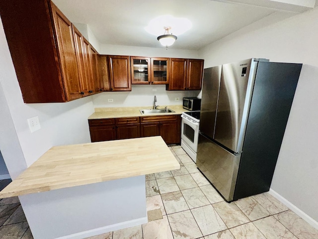 kitchen featuring sink and appliances with stainless steel finishes