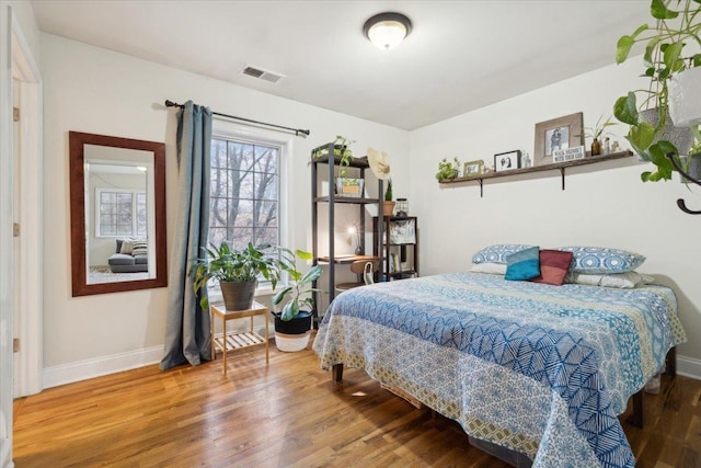 bedroom featuring hardwood / wood-style floors