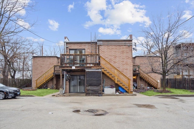 back of house featuring a deck