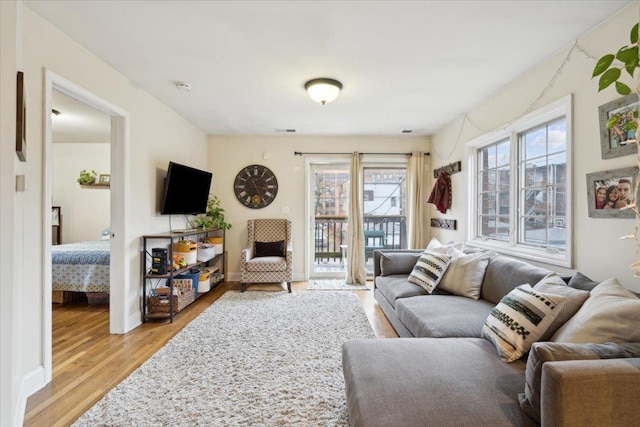 living room with light hardwood / wood-style floors