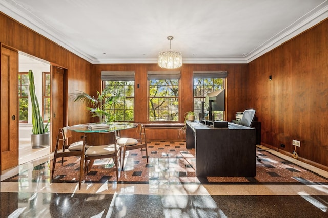 interior space with a notable chandelier, wooden walls, and ornamental molding