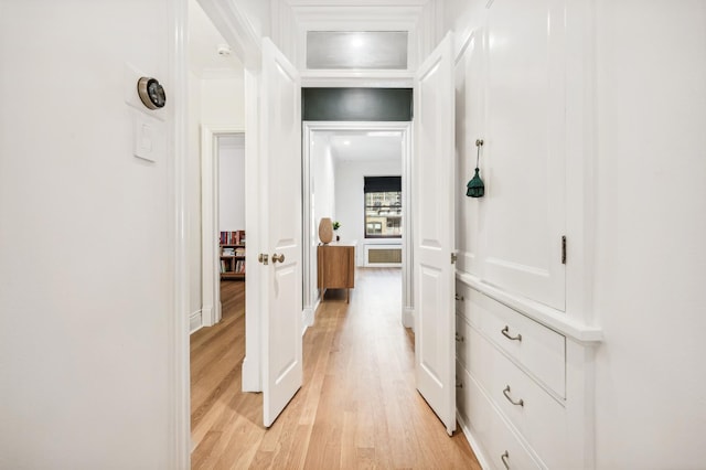 corridor with light wood-type flooring