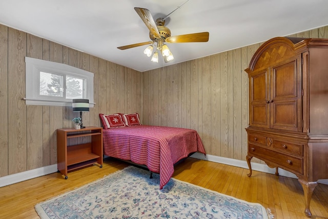 bedroom featuring hardwood / wood-style floors and ceiling fan