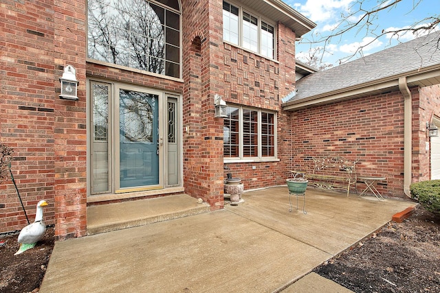 property entrance with a patio area