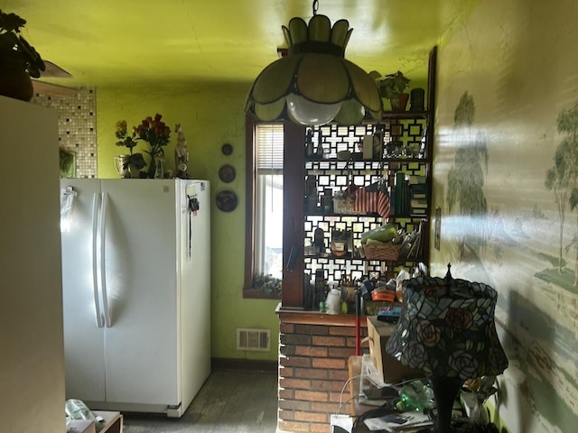 kitchen with ceiling fan and white fridge