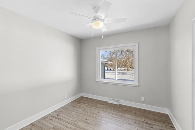 spare room with ceiling fan and light hardwood / wood-style flooring