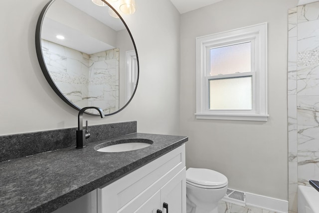 full bathroom with tiled shower / bath combo, vanity, and toilet