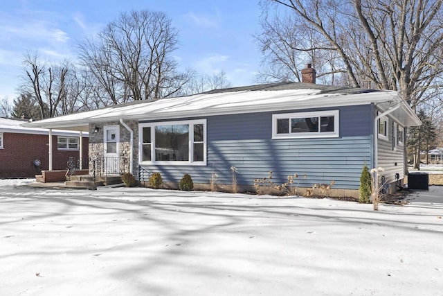 single story home featuring central AC unit