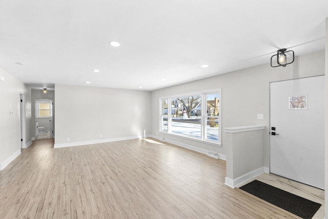 entryway with light hardwood / wood-style floors