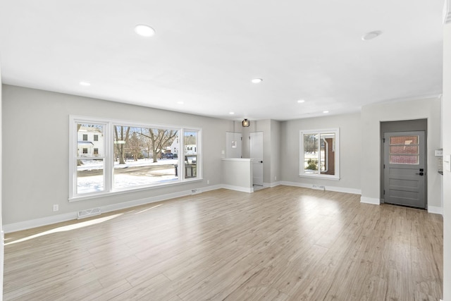 unfurnished living room with light hardwood / wood-style flooring