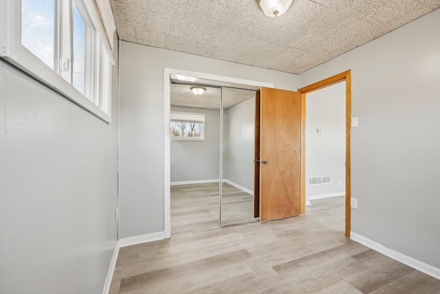 hallway featuring light wood-type flooring