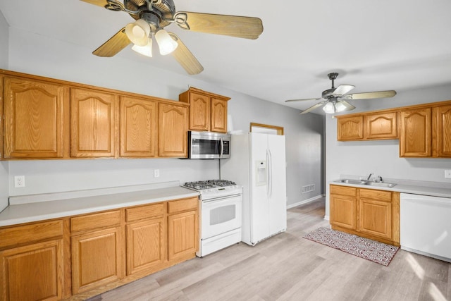 kitchen with ceiling fan, sink, white appliances, and light hardwood / wood-style flooring