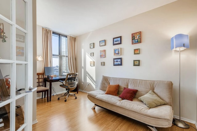 office area featuring hardwood / wood-style flooring and french doors