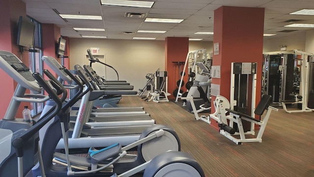 gym featuring a drop ceiling