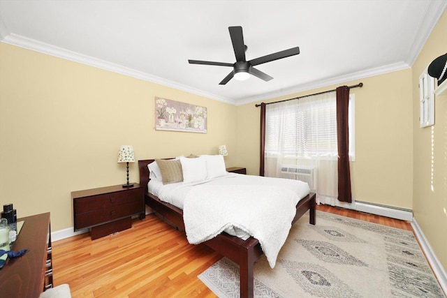 bedroom featuring a baseboard heating unit, wood-type flooring, ornamental molding, and a wall mounted AC