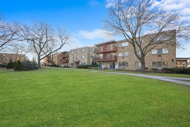 view of community featuring a yard